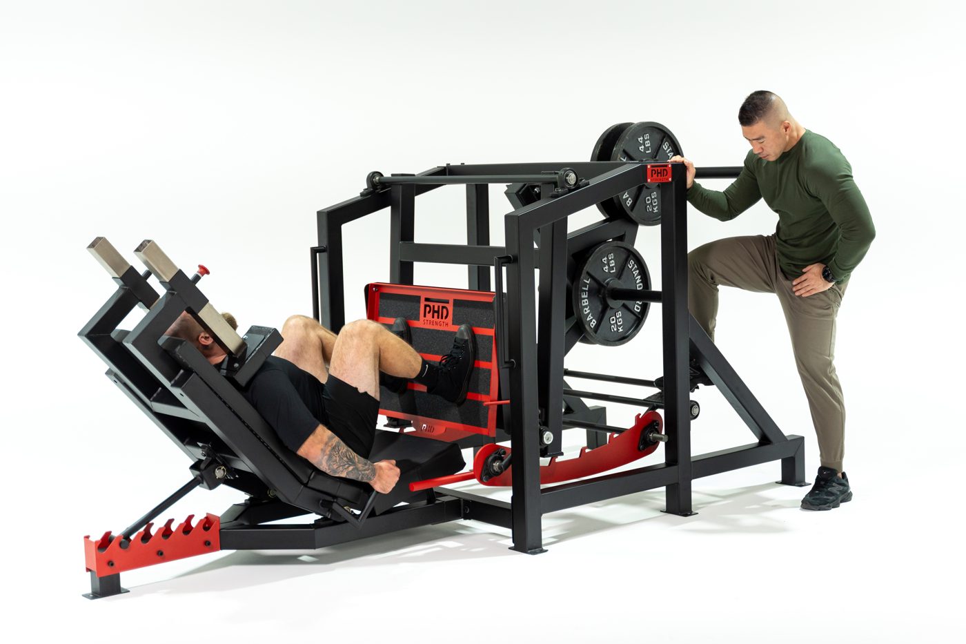 Spotter re-racking the weight while the lifter stays in the machine